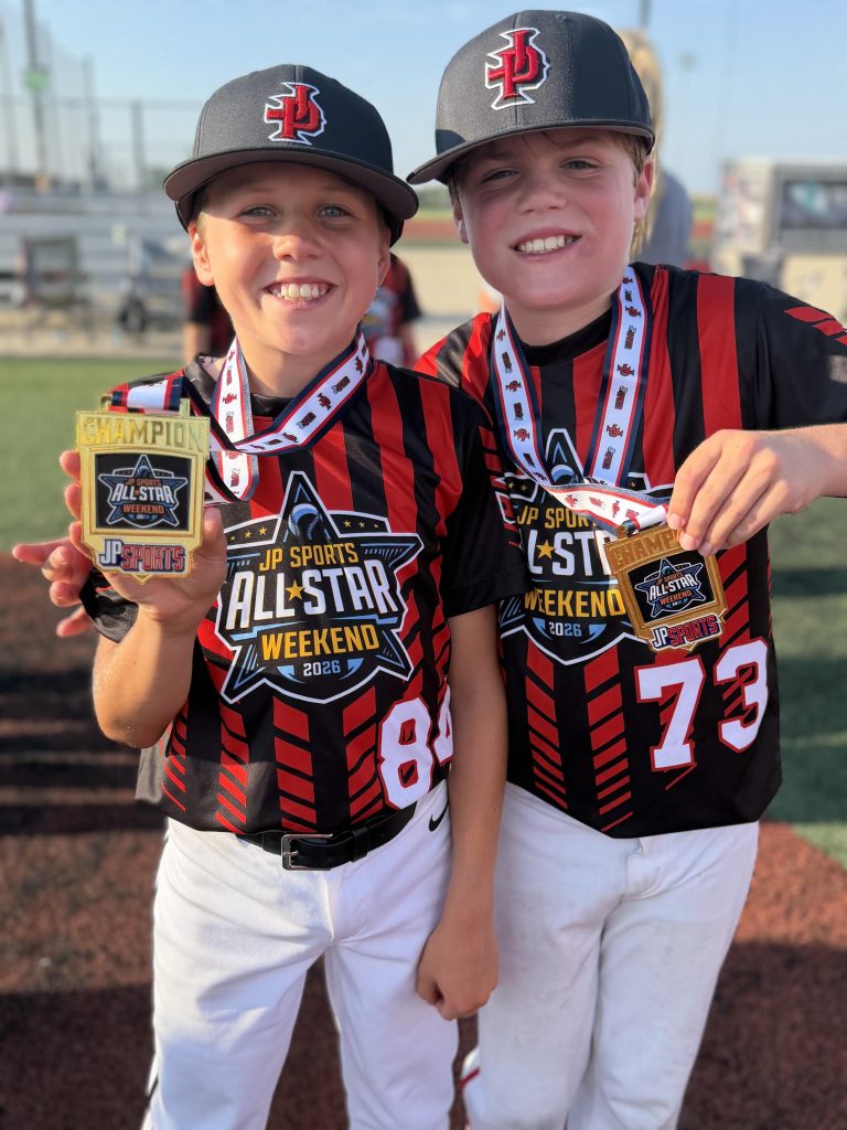 Jeffrey and Noah holding winning medals